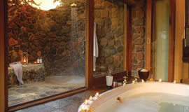 Luxurious bath with a view at Tuningi Safari Lodge