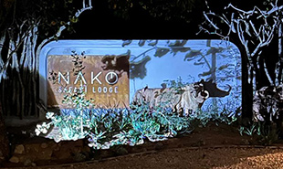 Entry sign to Nako with emblem of a buffalo and lodge name