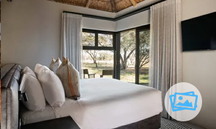 Double bed in bedroom with views outside