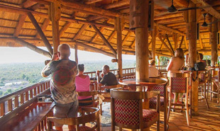 Guests on the deck of the Lodge viewing the waterhole
